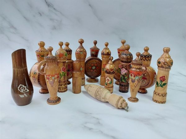 Collection of wooden bottles with the remains of perfumes and oils Collection of wooden bottles with the remains of perfumes and oils